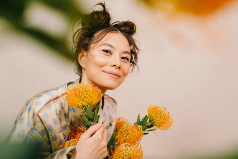 Happy Woman With Blooming Flowers