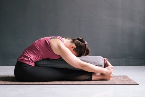 Supported Paschimottanasana for Digestion