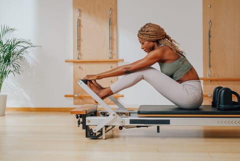 Woman Doing Pilates in a Studio