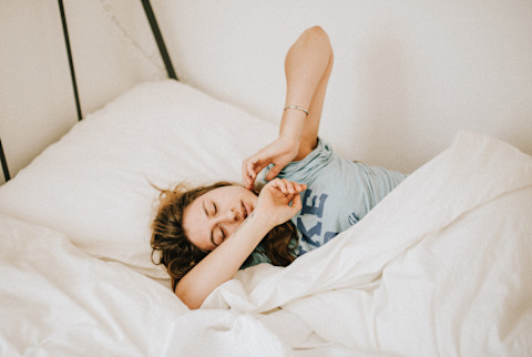Woman Tossing and Turning in Bed Woman Tossing and Turning in Bed