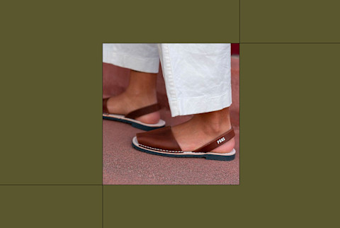 Pons Avarcas review shoes on feet on ground with green background Pons Avarcas review shoes on feet on ground with green background