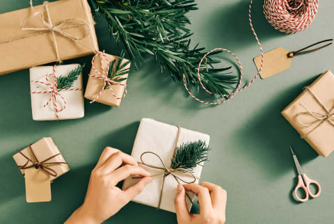 A Flatlay Of Christmas Decorations And Gift Box