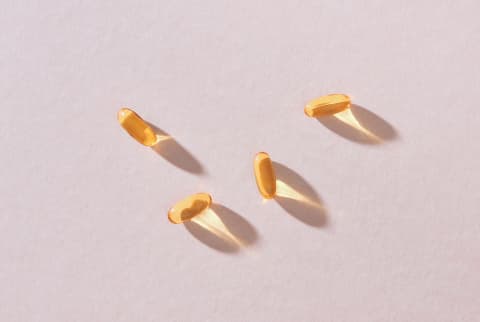 fish oil gelcaps on a soft background fish oil gelcaps on a soft background
