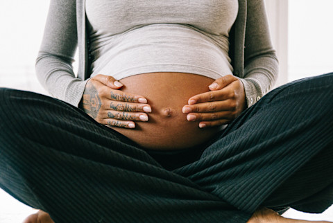 Unrecognizable Pregnant Woman Holding Her Belly