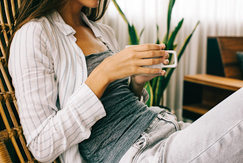 Unrecognizable Woman Relaxing At Home Drinking Tea Unrecognizable Woman Relaxing At Home Drinking Tea