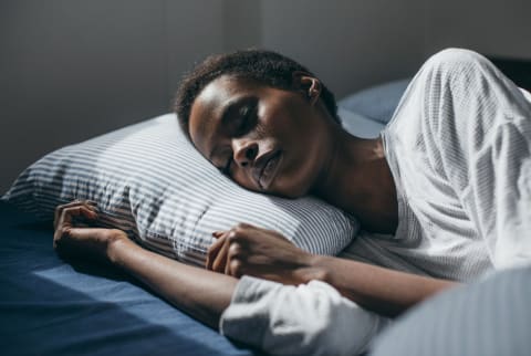 Woman Sleeping in Bed