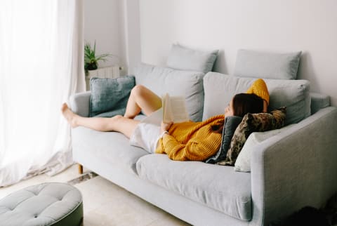 Woman Reading a Book At Home