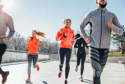 Group of Friends Running Outdoors in Cold Weather