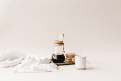 drip coffee maker set up with mug on platter