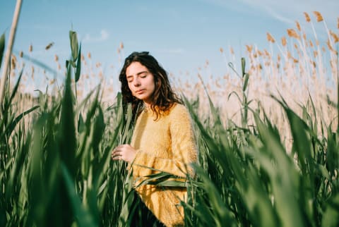 Young woman in harmony with nature