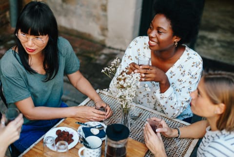 Group of Women Drinking Coffee Outdoors at a Cafe