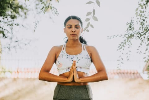 Woman Meditating Outdoors