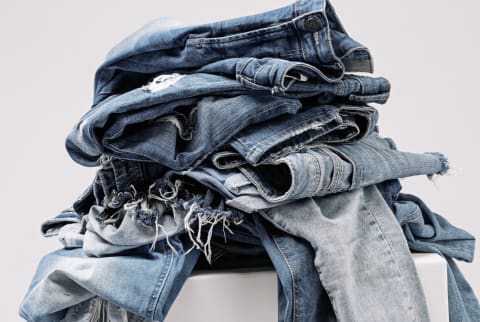 stack of donated jeans