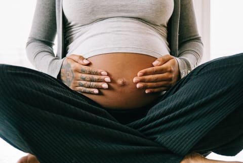Unrecognizable Pregnant Woman Holding Her Belly