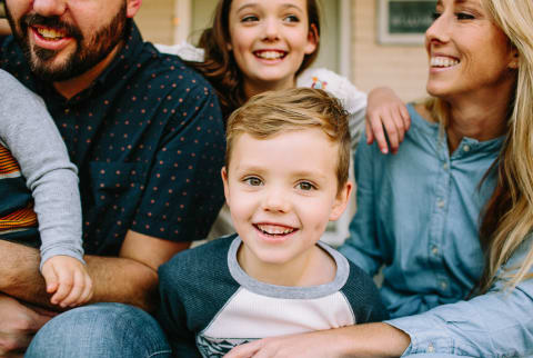 Family Portrait - Smiling on their Front Porch