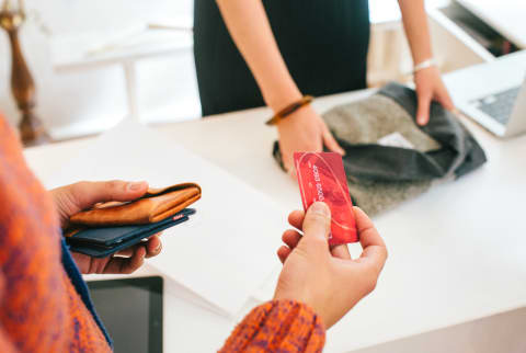 Woman Purchasing Something with Credit Card