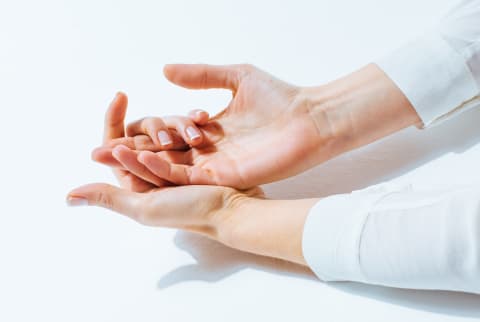 Woman's hands with clean, bare nails