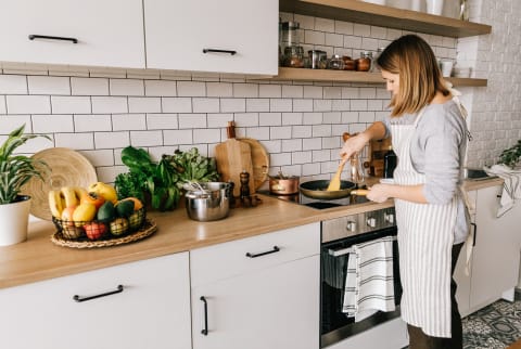 Woman cooking in kitchen