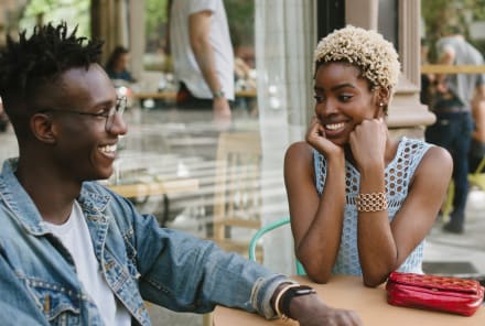 10 Subtle Signs A Woman May Be Flirting, From Body Language Experts