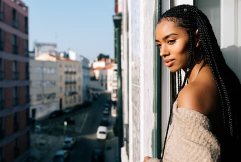 Woman Looking Out a Window