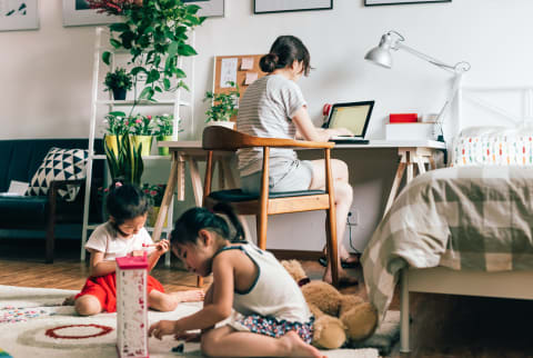 Mom Working & Kids Playing