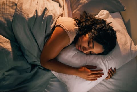 Woman Asleep In Bed