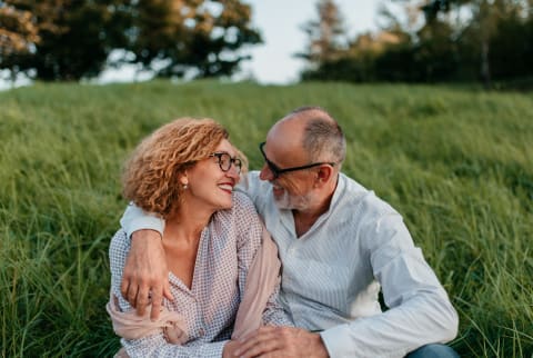 Image of couple smiling at each other, appearing emotionally connected.