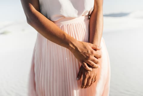 Unrecognizable Woman with Arms Together