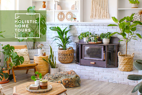 calming living room with plants and old-fashioned fireplace