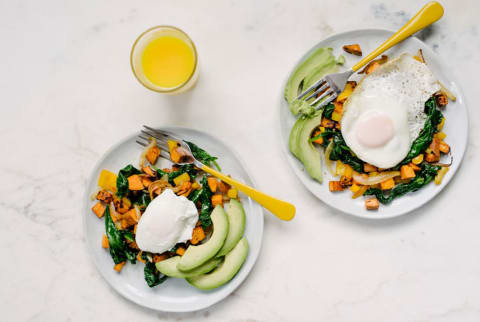 Healthy breakfast with egg, avocado, sweet potato, spinach, and orange juice