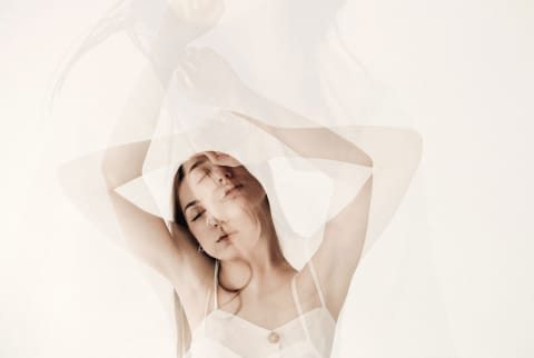 Multiple exposure photograph of a stressed out woman