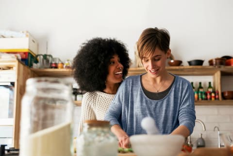 Two women cooking