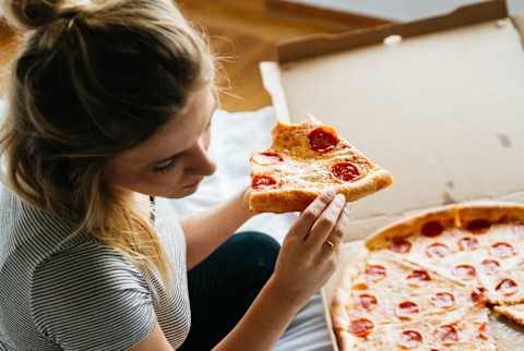 woman eating pizza woman eating pizza