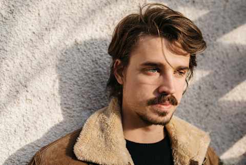 Portrait of a young fine looking man, outdoors. Portrait of a young fine looking man, outdoors.