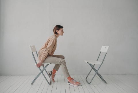 Image of person sitting alone by themselves.