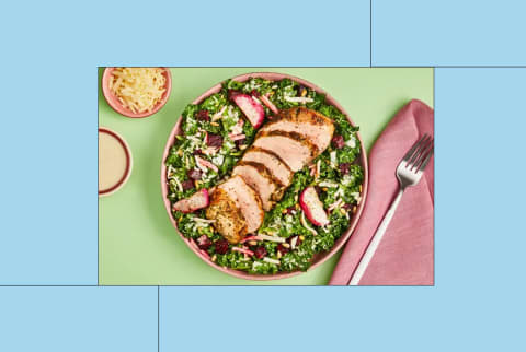Green Chef meal of pork chop on kale salad in creative image