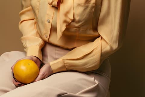 A Woman Holding Fruit