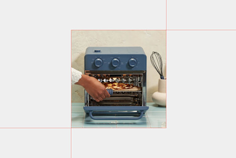 our place wonder oven in blue colorway on light grey background our place wonder oven in blue colorway on light grey background