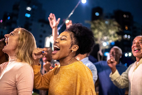 People cheering outdoors People cheering outdoors