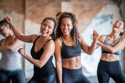 Women dancing at a workout class Women dancing at a workout class