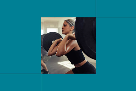 photo of woman lifting heavy dumbbell on blue background photo of woman lifting heavy dumbbell on blue background