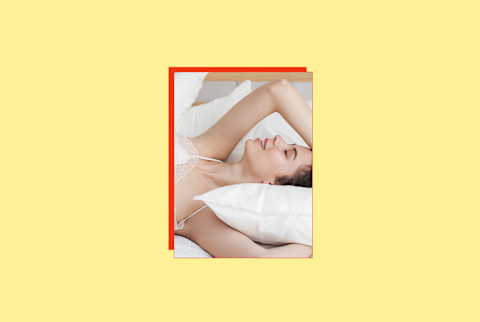 photo of woman on bed with arms over her head on yellow background photo of woman on bed with arms over her head on yellow background