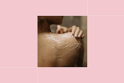image of the back of a woman's upper back and shoulder with soap on it image of the back of a woman's upper back and shoulder with soap on it