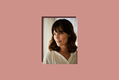 photo of dark haired woman smiling on pink background photo of dark haired woman smiling on pink background