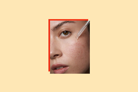 photo of woman's face using serum dropper on yellow backgorund photo of woman's face using serum dropper on yellow backgorund
