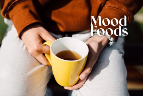 Person holding mug of tea Mood Foods