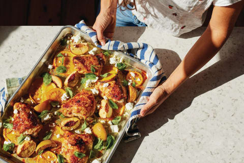 Woman cooking a healthy sheet-pan dinner 