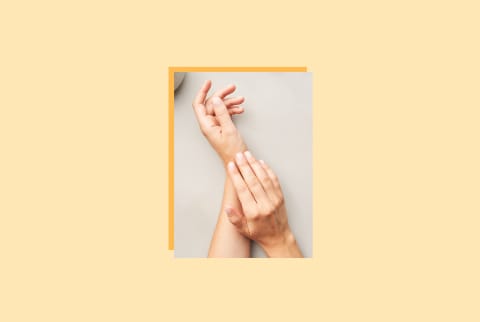 image of woman's hands on yellow background