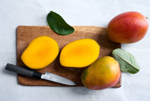 mangos on a cutting board