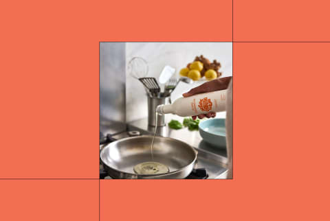 Algae Cooking Club image of someone pouring bottle into pan